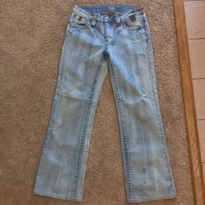 Mildly distressed jeans (Worn by Melissa Matsui)